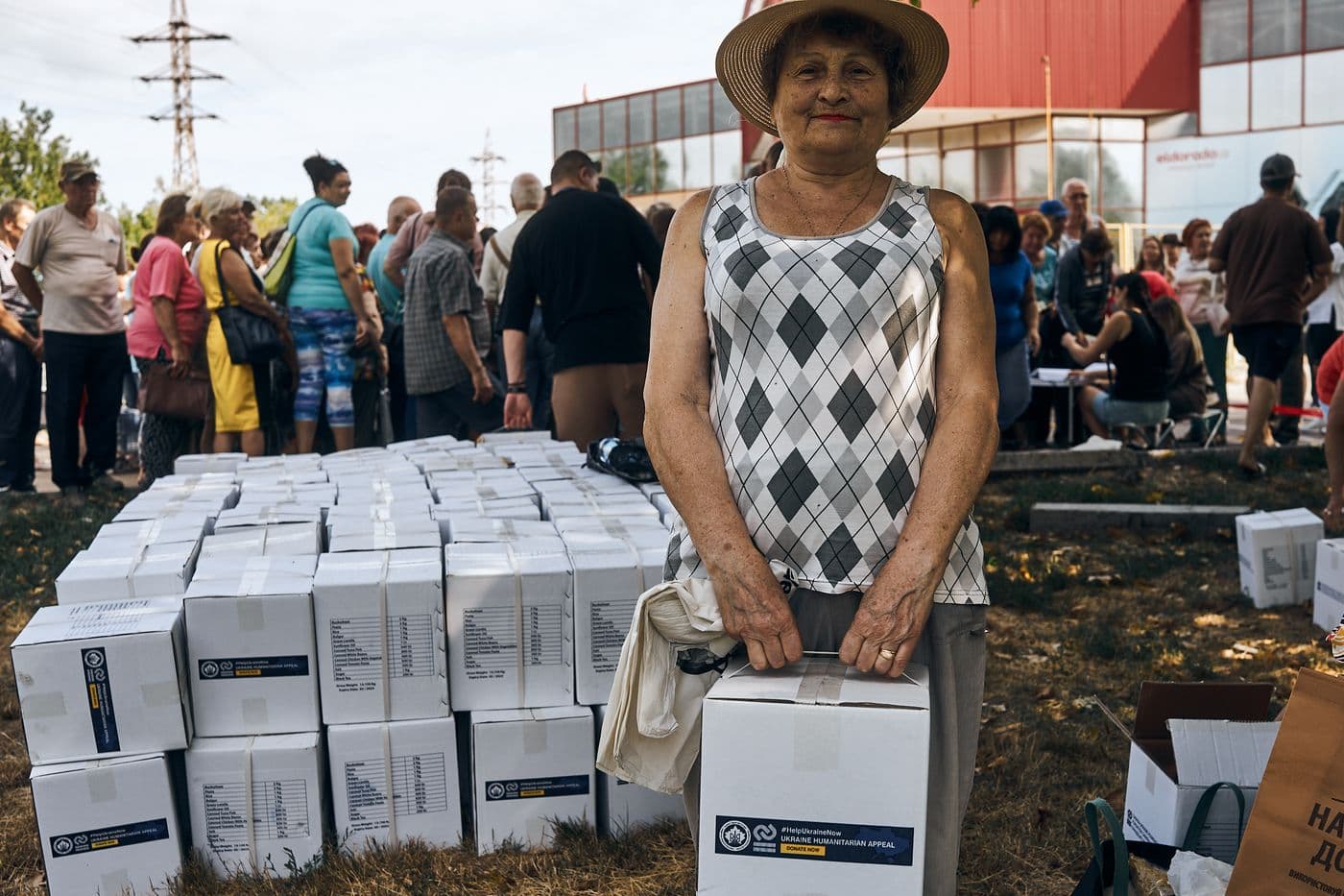 Volunteer carrying an aid box